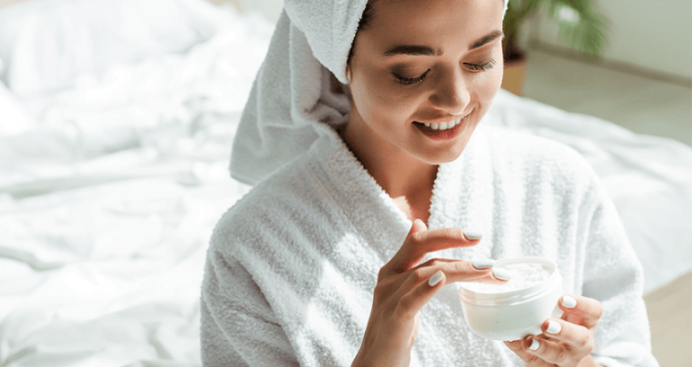 Woman with flawless glowing skin following expert skincare dos and don'ts