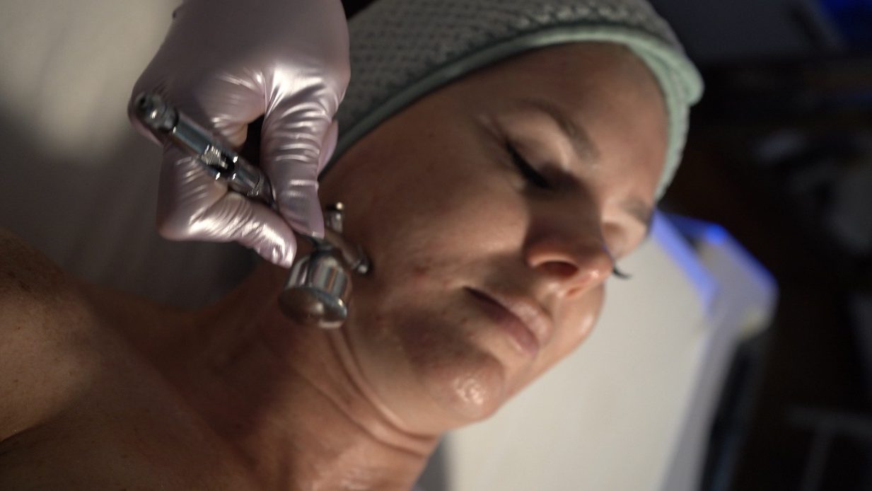 Professional facial treatment addressing skin changes through the jawline
