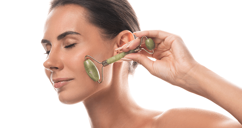 Using a jade roller on the face
