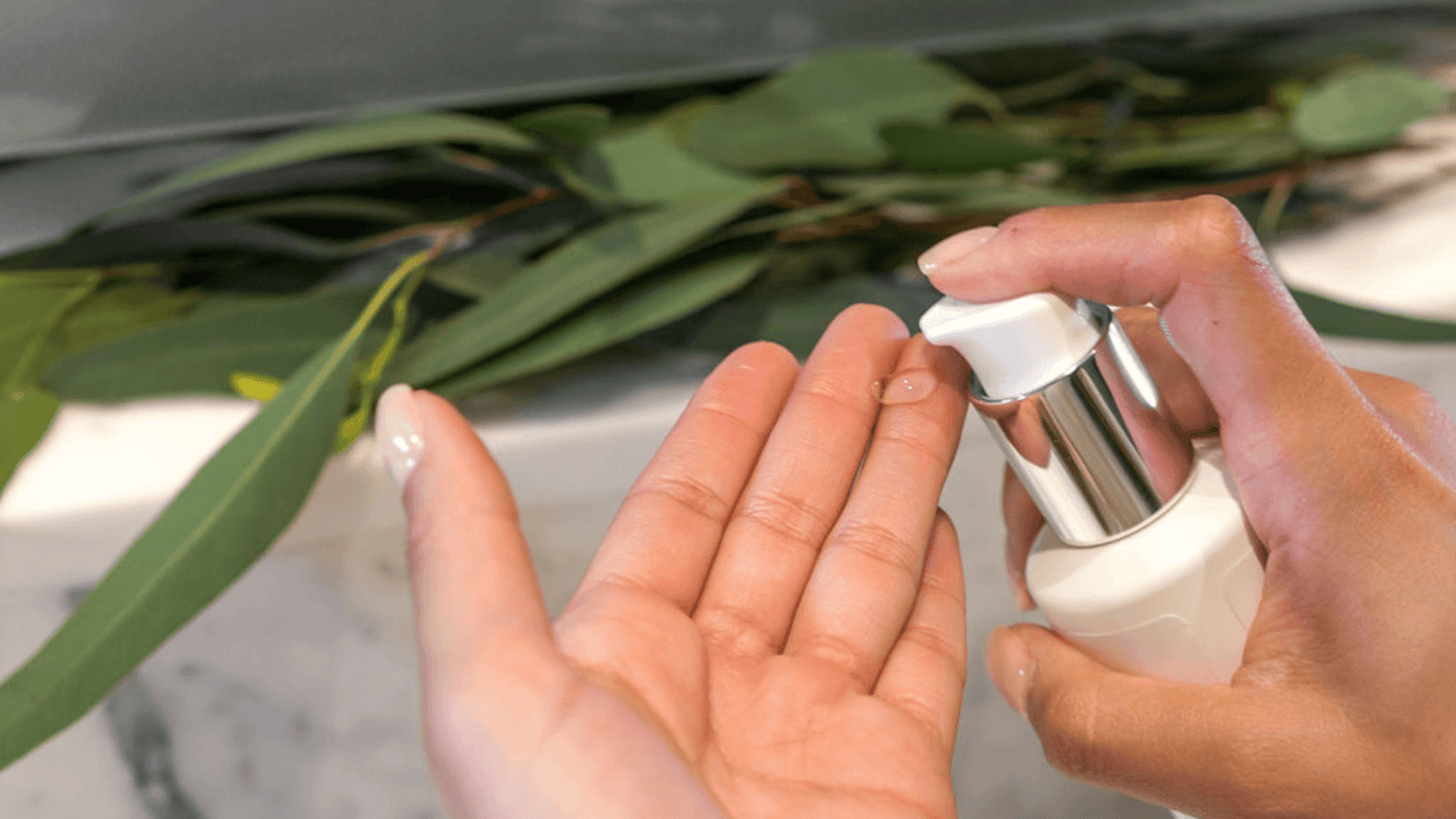Pumping a TSB serum onto hands with leaves in the background
