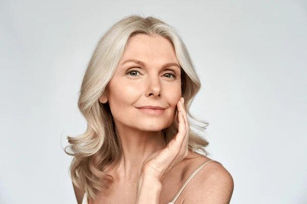 Woman with healthy glowing skin navigating skincare changes during menopause