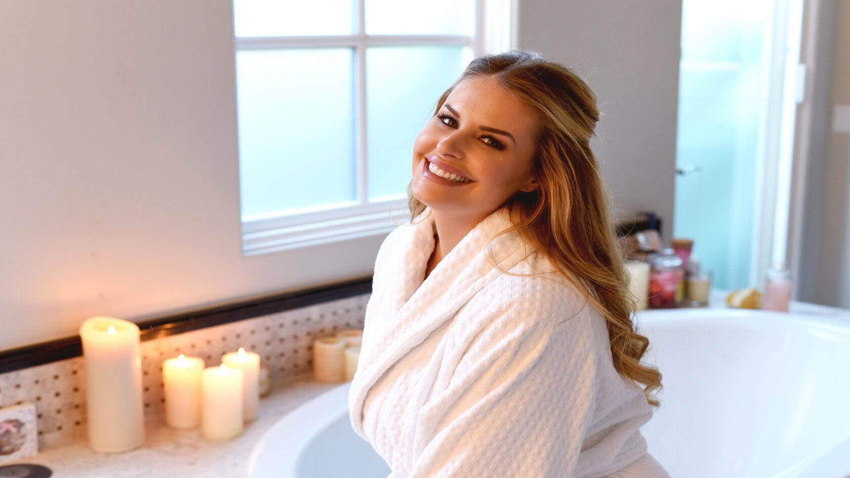 Woman practicing a holistic beauty ritual for inner and outer radiance at The Skincare Boutique