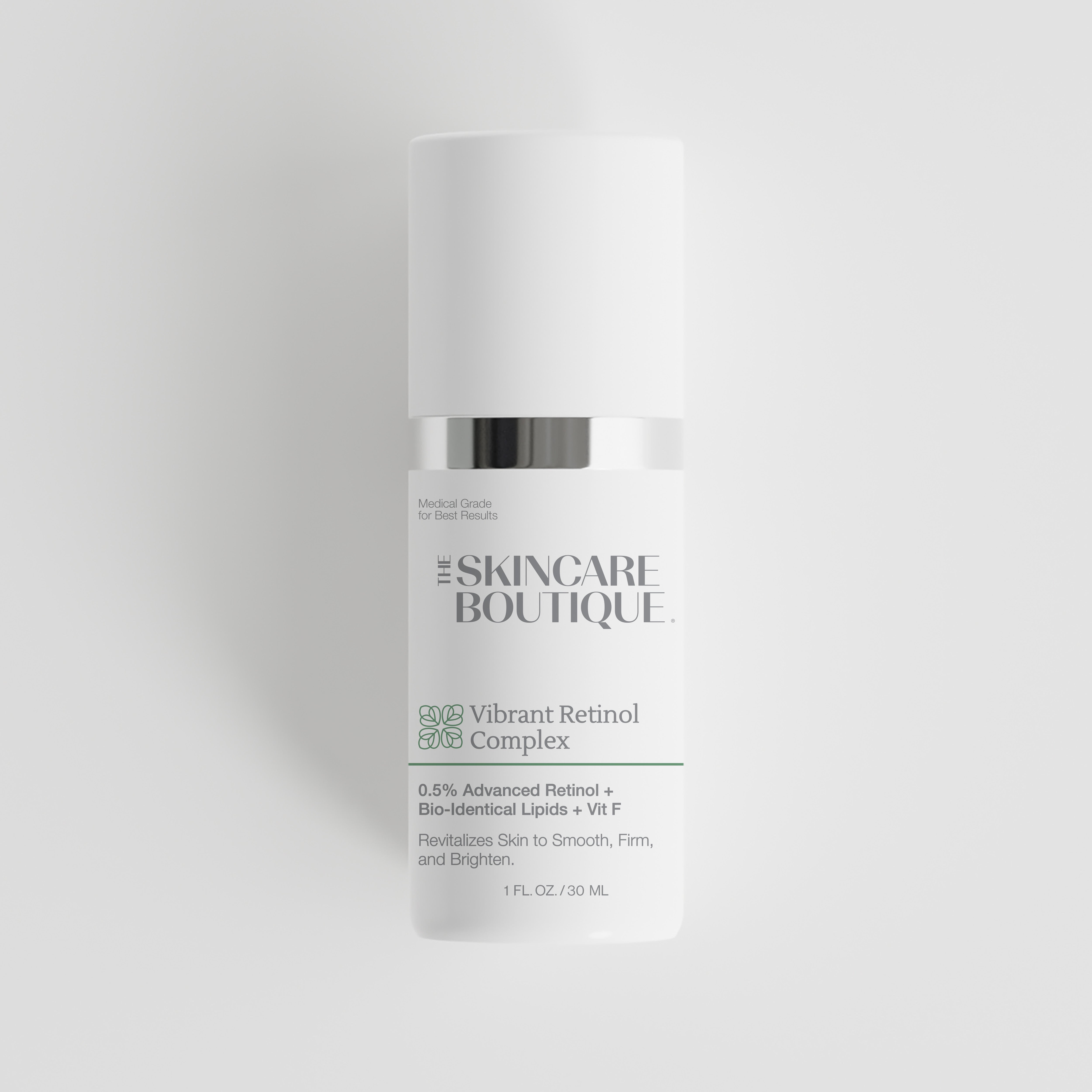 A white skincare bottle with a silver band and a white cap, labeled 'The Skincare Boutique Vibrant Retinol Complex' on a light gray background.